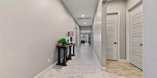 Image 4: Foyer with title flooring, recessed lighting