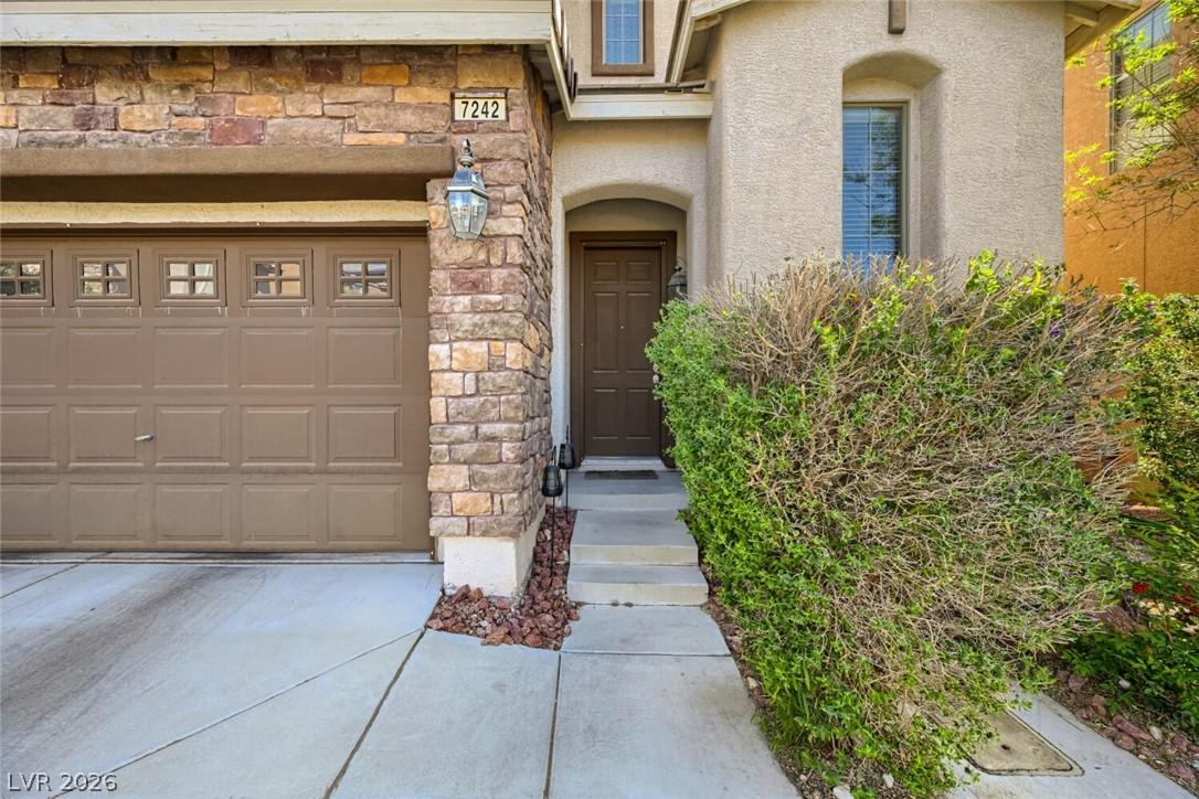Image 4: This inviting home facade features a seamless blen