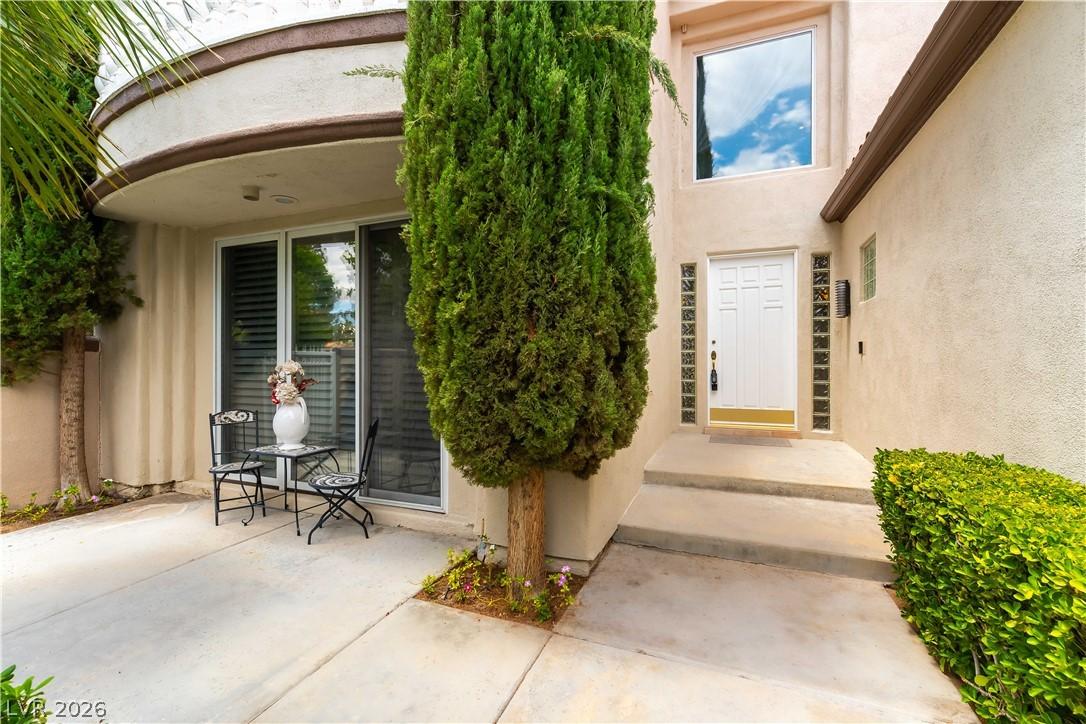 Image 2: A graceful entry with inviting outdoor seating alo