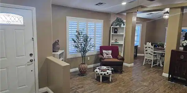 Image 4: A welcoming entryway flows into a generously propo