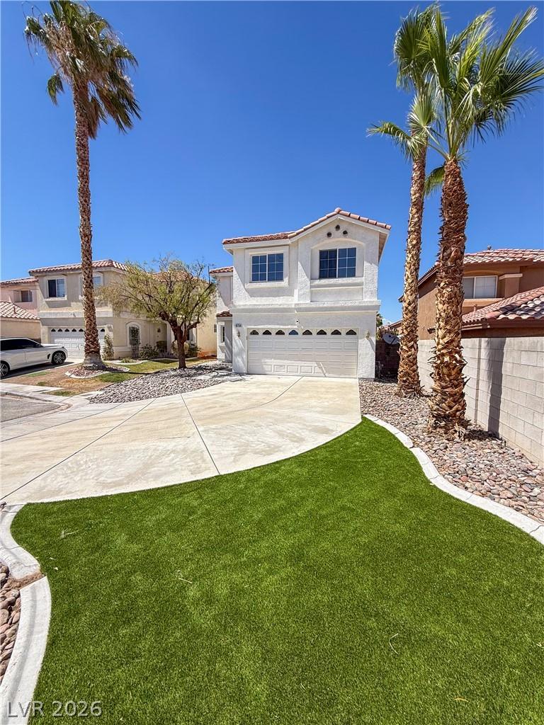 Image 1: Well-maintained front exterior with ample driveway