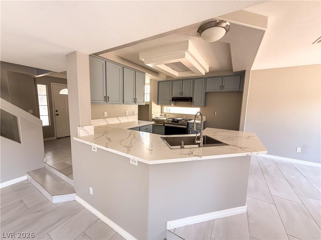 Image 4: Gleaming countertops and sleek cabinetry define th
