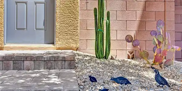Image 3: A welcoming front entrance features sturdy block s