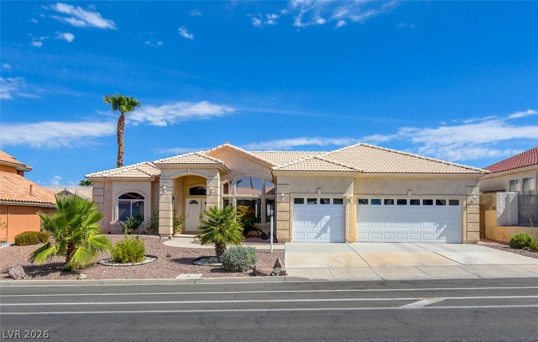 Image 3: A desert oasis with a cream-colored exterior, an i