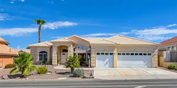 Image 3: A desert oasis with a cream-colored exterior, an i