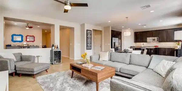 Image 4: An inviting open-concept living area blends seamle