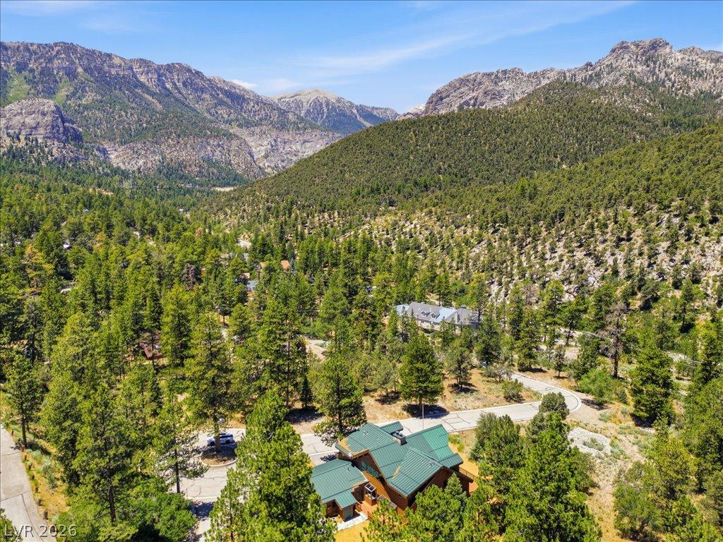 Image 2: A tranquil mountain retreat awaits, nestled amidst