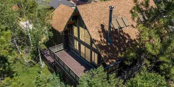 Image 2: Perched among the trees, this charming A-frame cab
