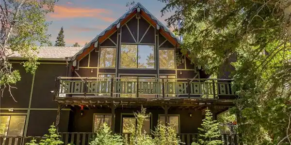 Image 3: A charming A-frame chalet, featuring a generous ba