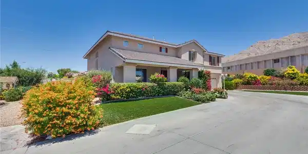 Image 2: A classic two-story residence boasts meticulous la