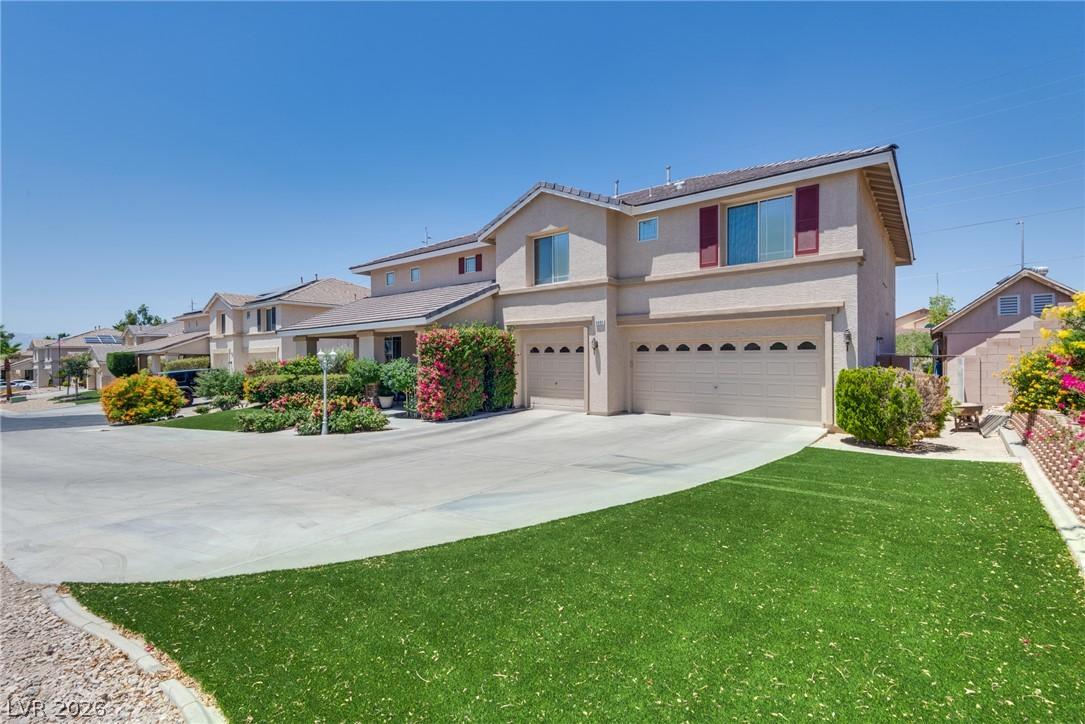 Image 4: Manicured landscaping and a long driveway welcome