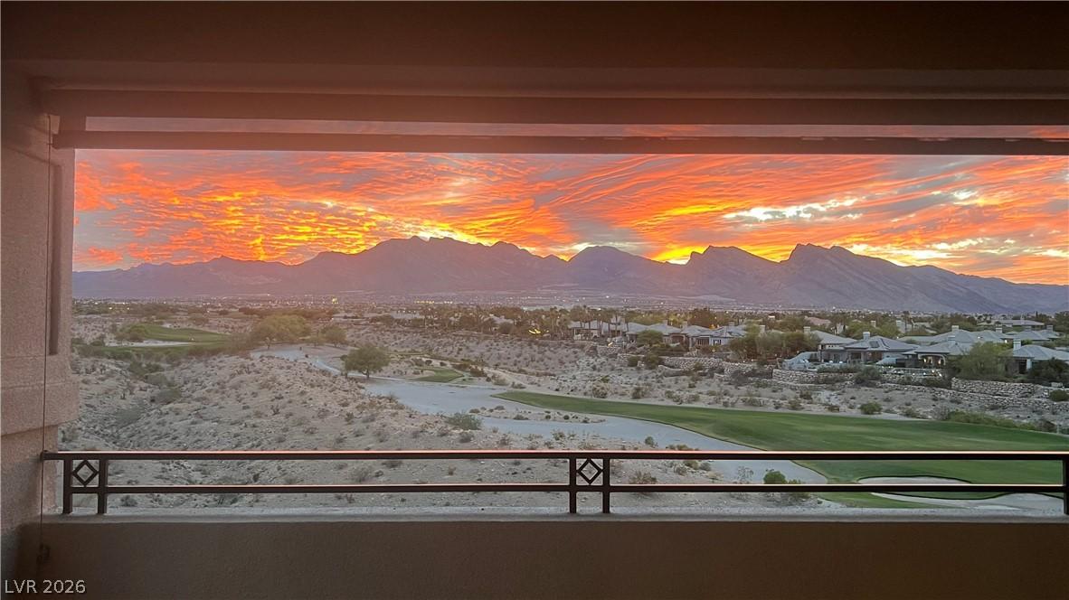 Image 3: A vibrant sunset over majestic mountains and a gol