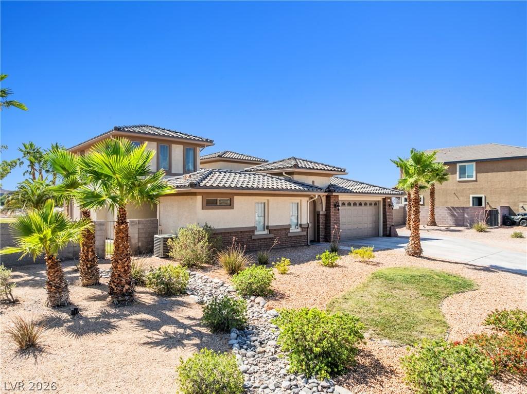 Image 3: A desert oasis with a well-maintained yard and ele