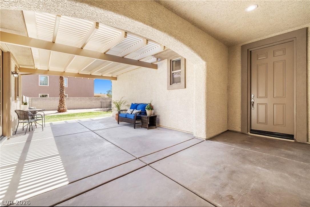 Image 4: A spacious covered patio offers a refreshing outdo