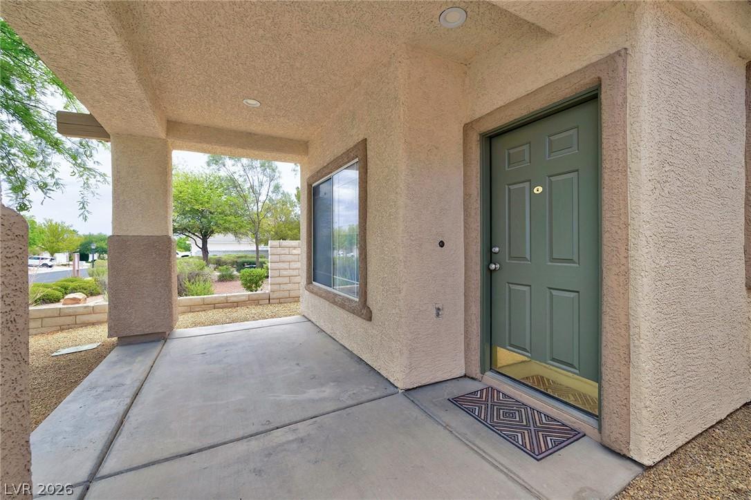 Image 4: A welcoming covered porch with recessed lighting i