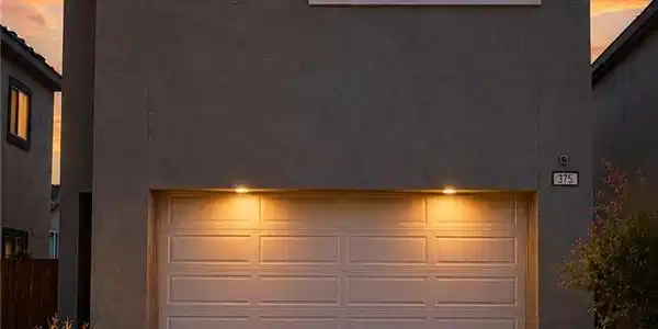 Image 3: Dramatic sunset hues enhance this modern stucco re