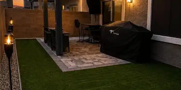 Image 4: An inviting paved patio with festive string lights