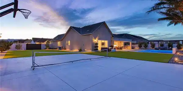 Image 3: A spacious backyard court offers abundant space fo