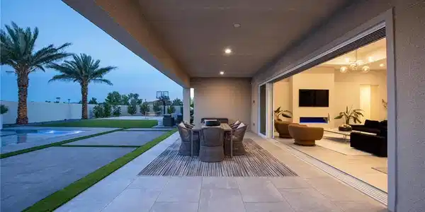 Image 4: A spacious covered patio seamlessly connects indoo
