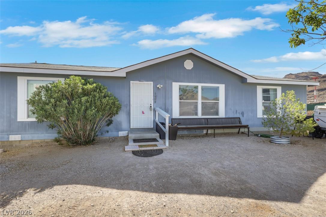 Image 2: A well-maintained single-story residence with a ne