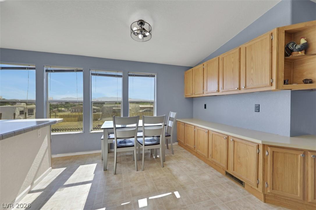 Image 4: A well-lit dining area offers a seamless transitio