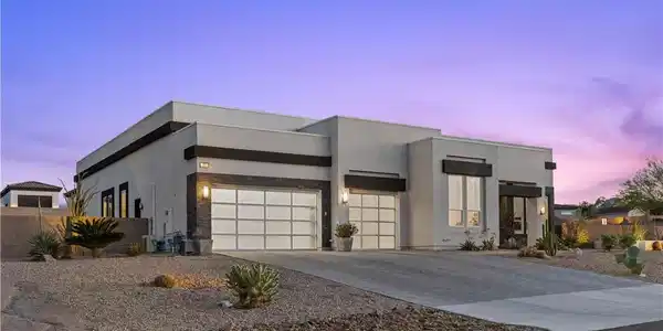 Image 2: This modern home features clean lines and a desert