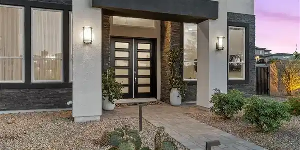 Image 4: The striking entrance features a clean-lined moder