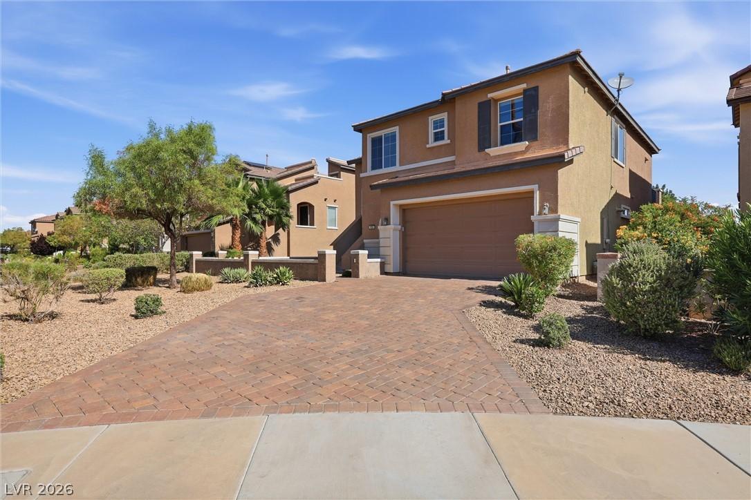 Image 2: A Mediterranean-inspired dwelling with a paver dri