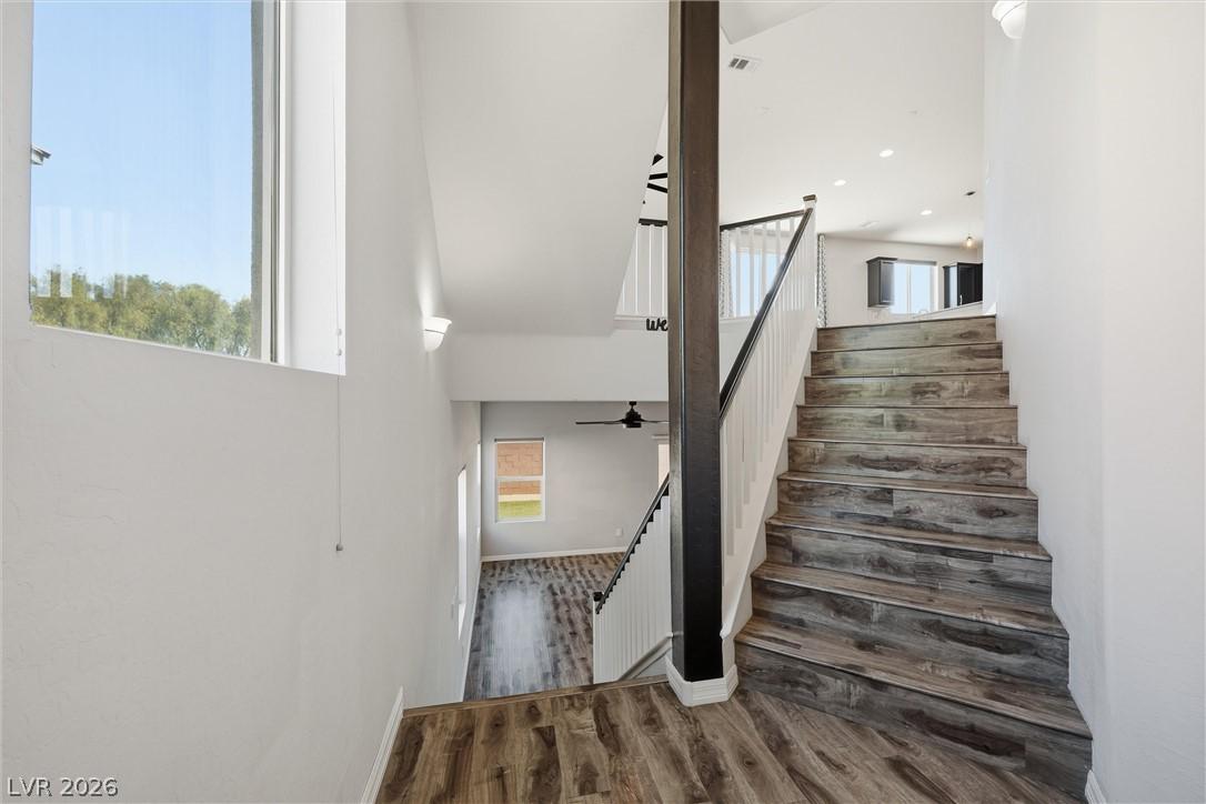 Image 4: Split-level living with warm wood-look flooring an