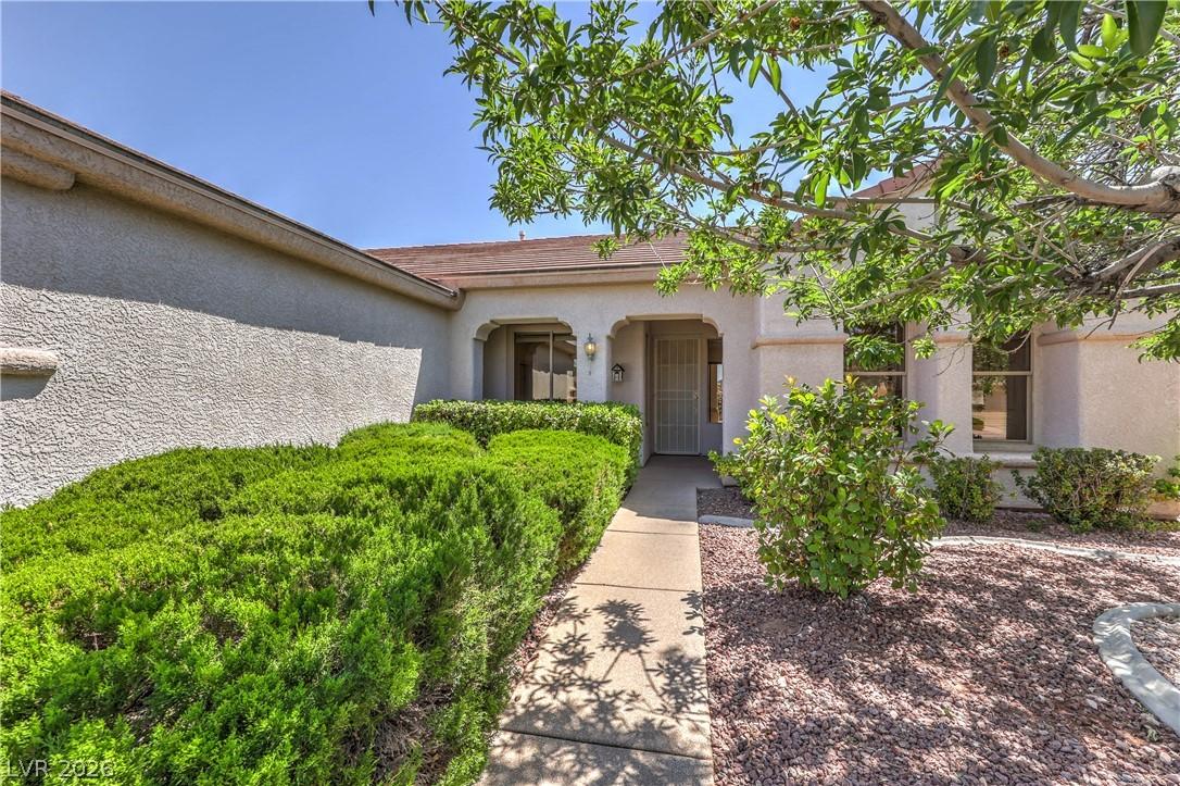 Image 2: A welcoming front path leads to a home boasting ma