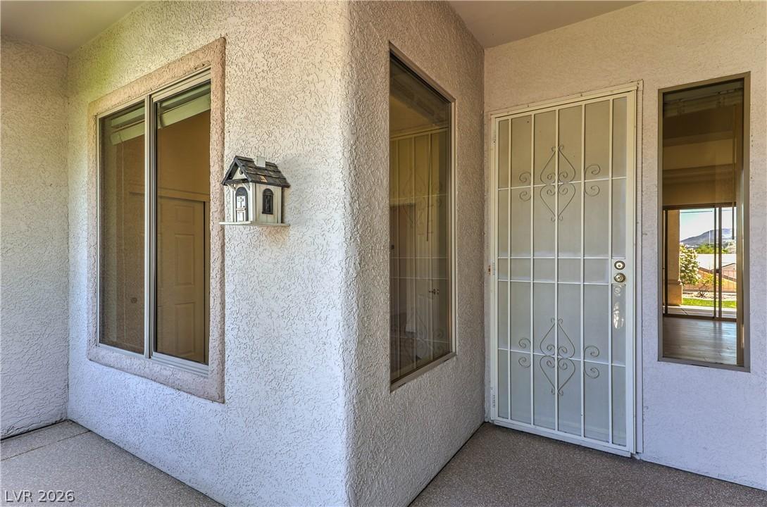 Image 3: Secure entry via a detailed metal security door, f