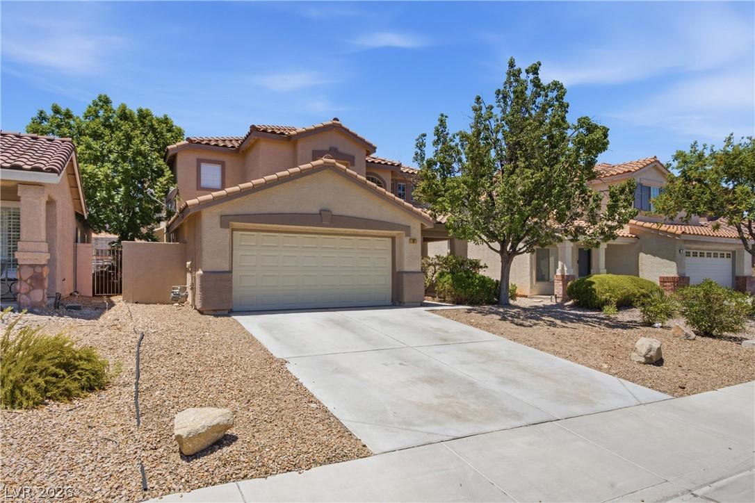 Image 2: An inviting exterior with a desert-friendly landsc