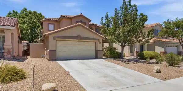 Image 2: An inviting exterior with a desert-friendly landsc