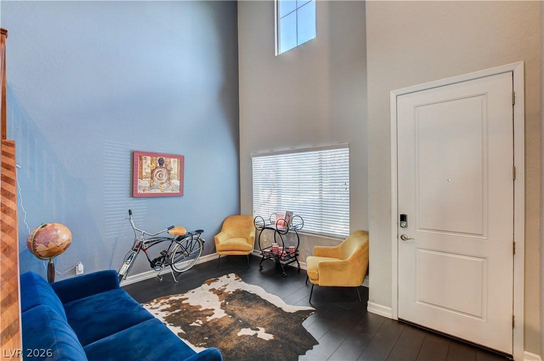 Image 4: High ceilings and rich wood flooring define this i