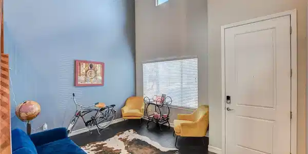 Image 4: High ceilings and rich wood flooring define this i