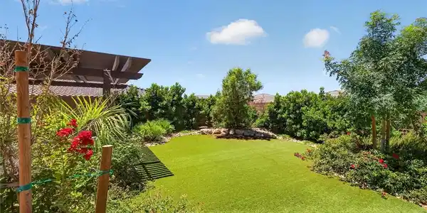Image 3: A private yard with vibrant plantings, manicured g