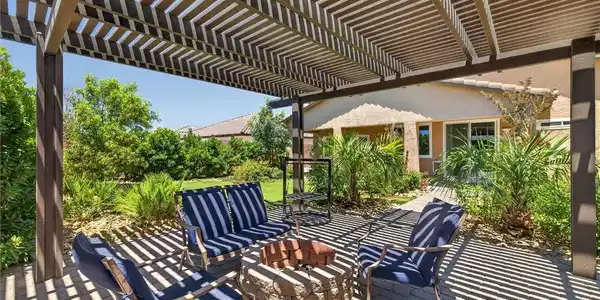 Image 4: An inviting outdoor retreat, featuring a fire pit