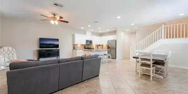 Image 4: An open floorplan seamlessly connects the living r