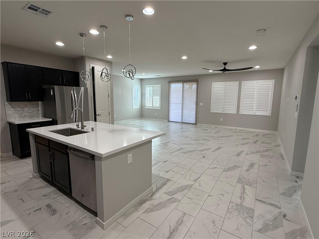 Image 3: A well-lit interior showcases a contemporary kitch