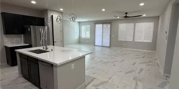 Image 3: A well-lit interior showcases a contemporary kitch