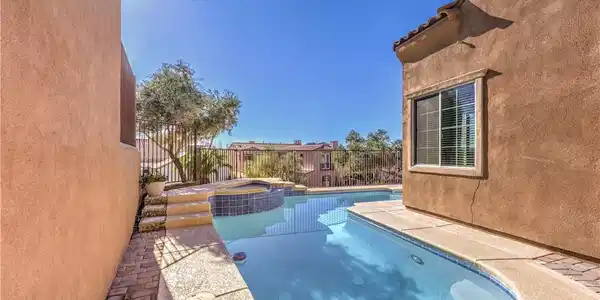 Image 2: An inviting private pool and spa await with ample