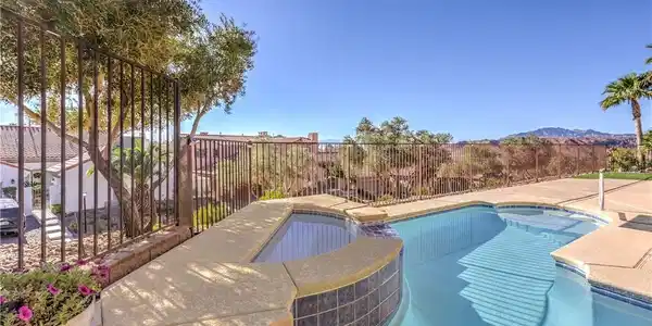 Image 3: A tranquil courtyard features a sparkling pool and