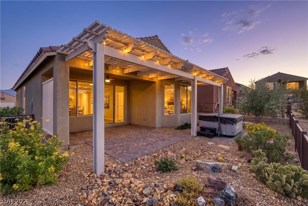 Image 3: A spacious backyard features a covered patio with