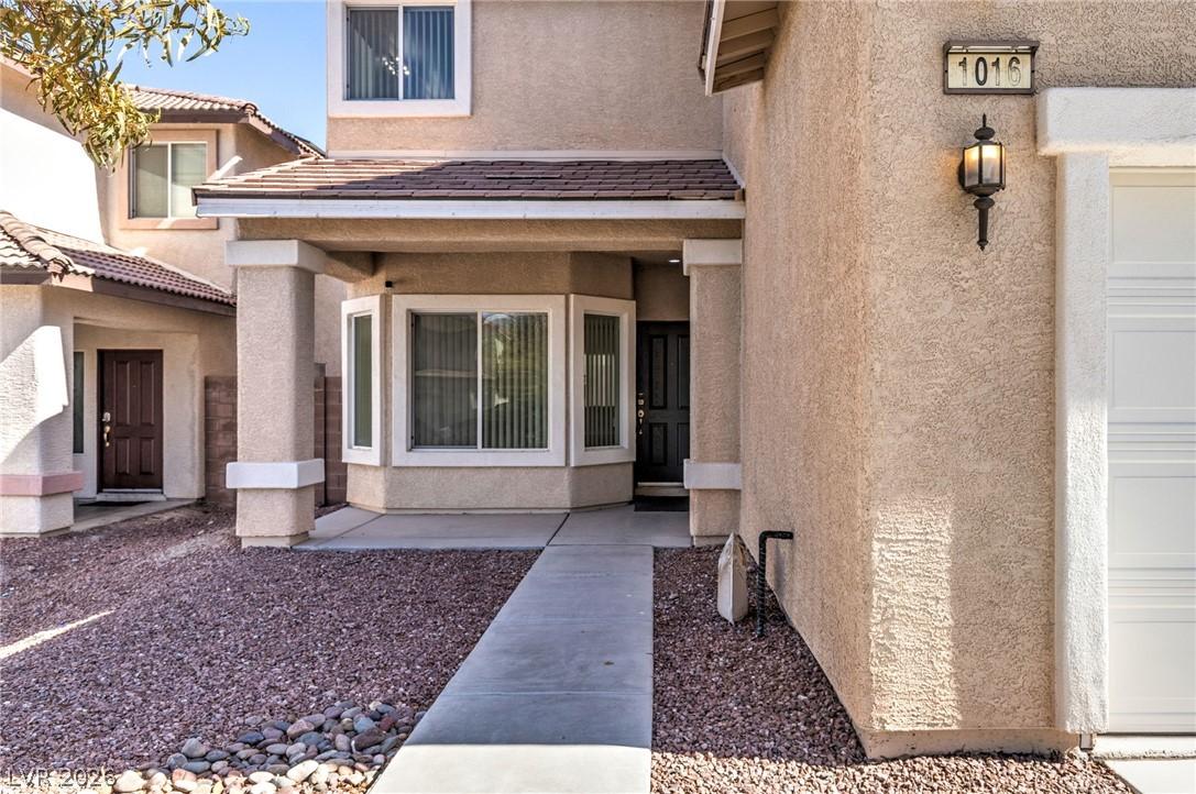 Image 4: A welcoming home with a covered entry and bay wind