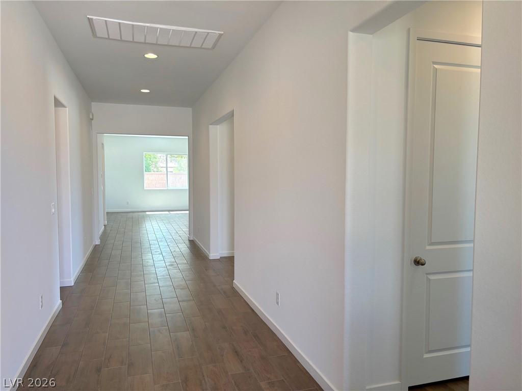 Image 3: Corridor featuring dark wood-style floors and rece