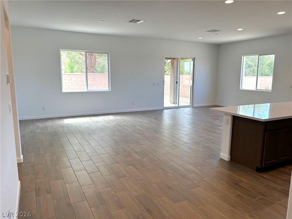 Image 4: Sun-filled interior with plank-style ceramic tile