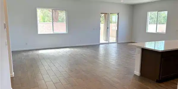 Image 4: Sun-filled interior with plank-style ceramic tile