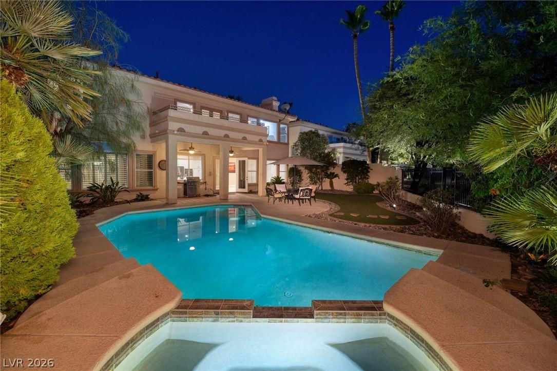 Image 2: An illuminated backyard oasis awaits with a shimme