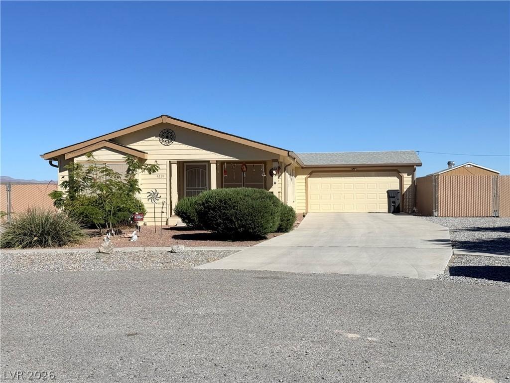 Image 3: This single-story home with an attached garage and