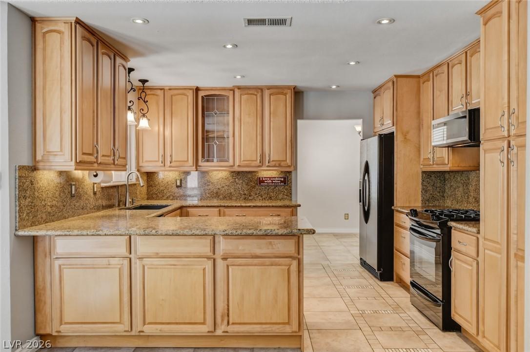 Image 1: A well-appointed culinary space featuring extensiv